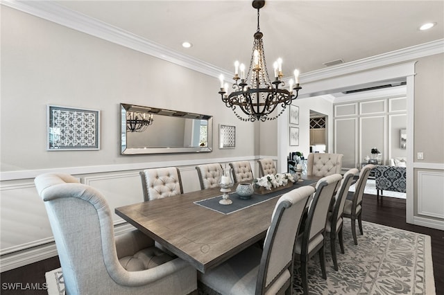 4605 Azalea Dr, Naples, FL 34119 - dining area with a chandelier, a decorative wall, ornamental molding, dark wood-style flooring, and recessed lighting