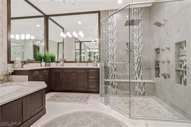 4605 Azalea Dr, Naples, FL 34119 - full bathroom with a stall shower, two vanities, and recessed lighting