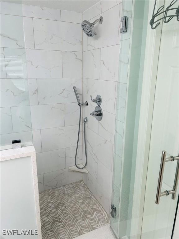 full bath with a shower stall