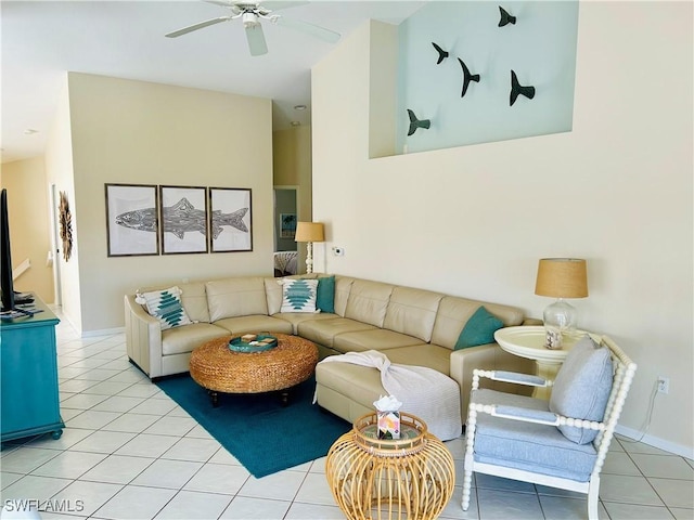 living area featuring light tile patterned floors and a ceiling fan