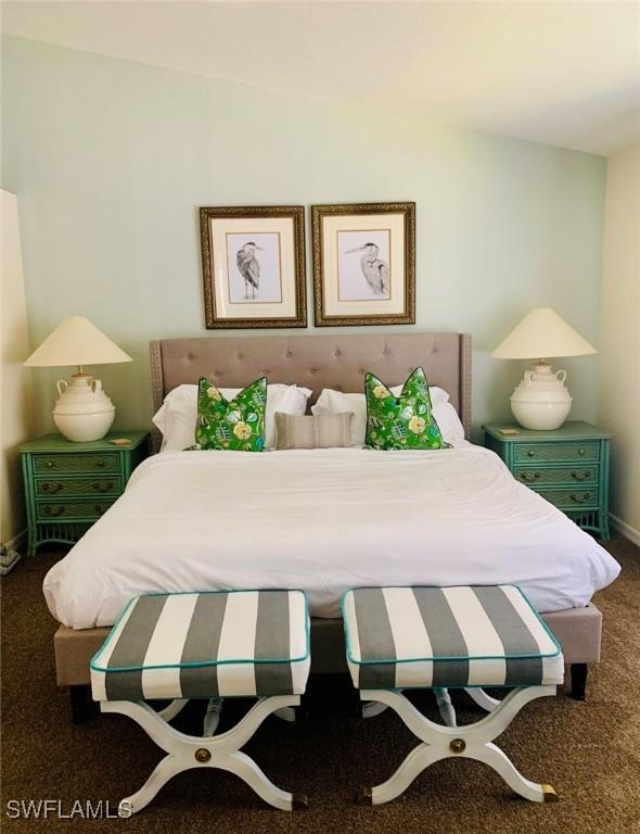 carpeted bedroom with baseboards