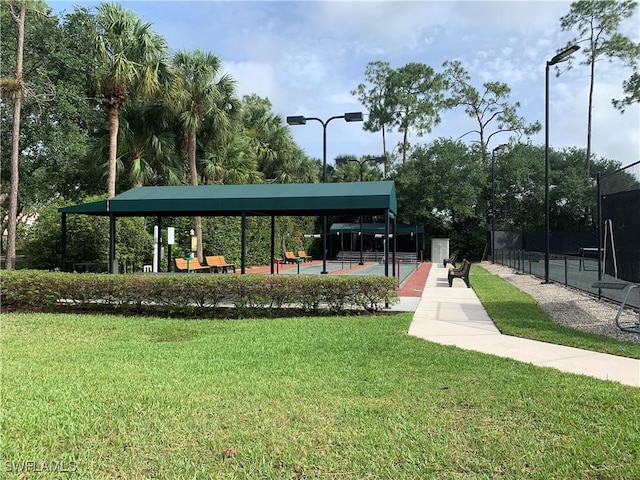 view of property's community with a yard