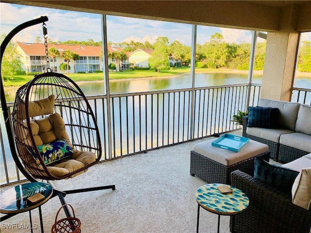 sunroom featuring an outdoor hangout area and a water view
