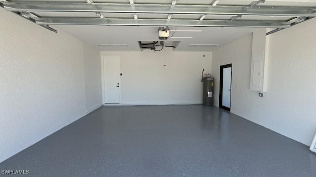garage with electric water heater and a garage door opener