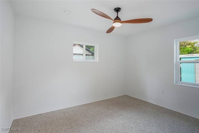 1478 Cordova Ave, Fort Myers, FL 33901 - empty room featuring speckle patterned floor, a ceiling fan, and baseboards