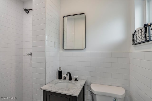 1478 Cordova Ave, Fort Myers, FL 33901 - bathroom with tile walls, toilet, and vanity