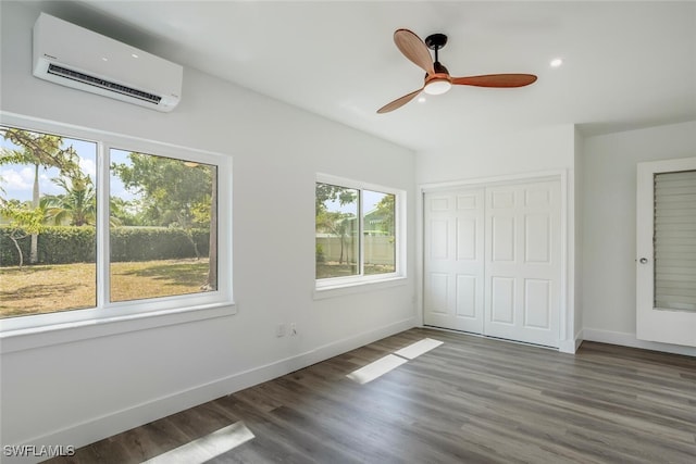 1478 Cordova Ave, Fort Myers, FL 33901 - unfurnished bedroom featuring a wall mounted air conditioner, wood finished floors, a closet, ceiling fan, and recessed lighting