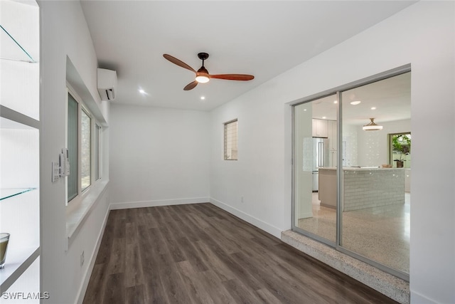 1478 Cordova Ave, Fort Myers, FL 33901 - empty room with ceiling fan, a wall mounted air conditioner, recessed lighting, baseboards, and wood finished floors