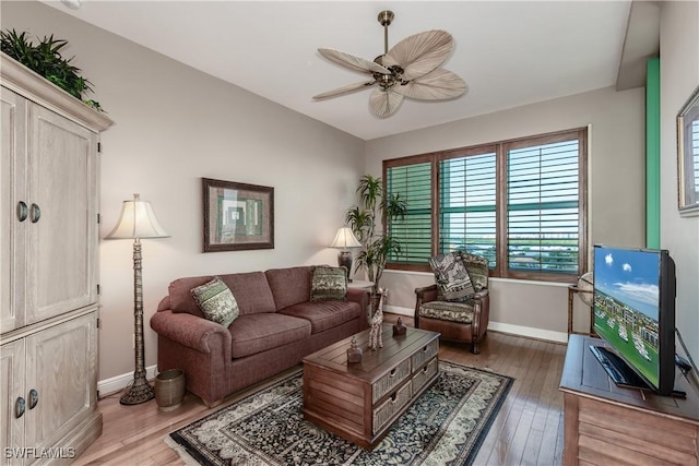 1079 Bald Eagle Dr Unit N703, Marco Island, FL 34145 - living room featuring baseboards, ceiling fan, and light wood-type flooring