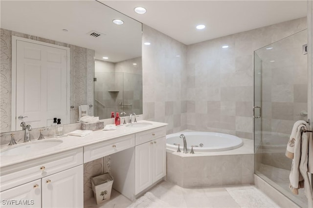 1079 Bald Eagle Dr Unit N703, Marco Island, FL 34145 - full bathroom featuring a sink, a bath, a shower stall, and visible vents