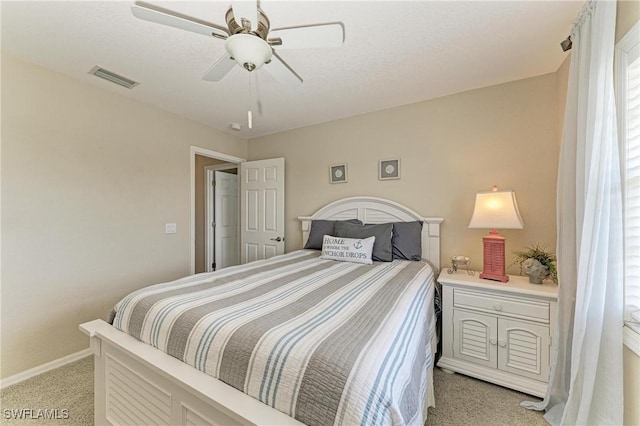 5010 La Costa Island Ct, Punta Gorda, FL 33950 - bedroom featuring light colored carpet, baseboards, and a ceiling fan
