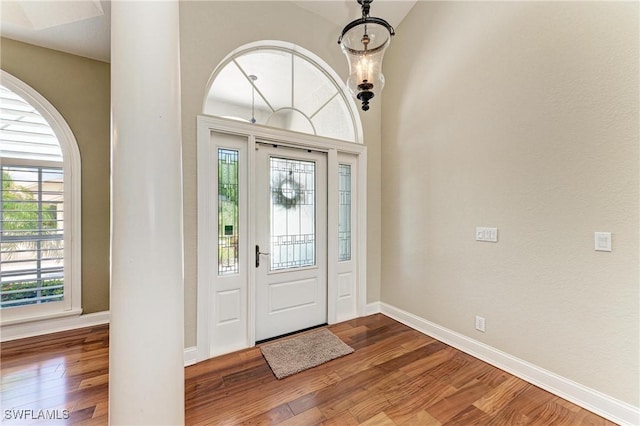 5010 La Costa Island Ct, Punta Gorda, FL 33950 - foyer entrance with wood finished floors, baseboards, and plenty of natural light