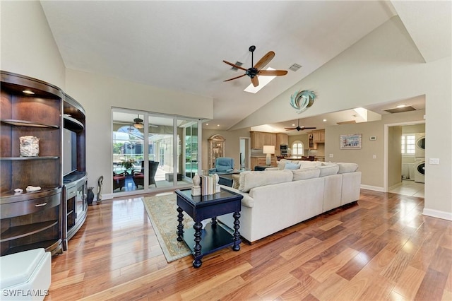 5010 La Costa Island Ct, Punta Gorda, FL 33950 - living room featuring ceiling fan, light wood-type flooring, healthy amount of natural light, and high vaulted ceiling