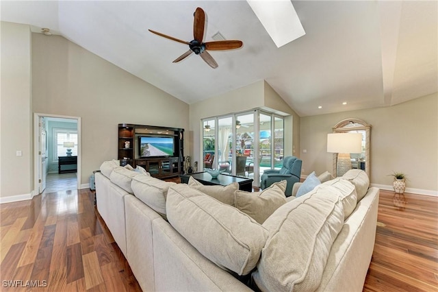 5010 La Costa Island Ct, Punta Gorda, FL 33950 - living room with ceiling fan, healthy amount of natural light, wood finished floors, baseboards, and high vaulted ceiling