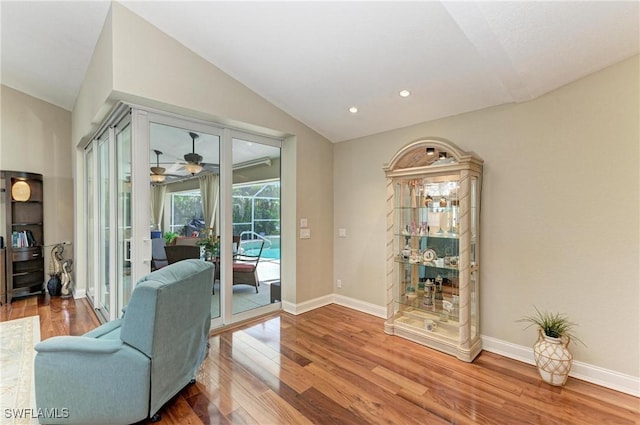 5010 La Costa Island Ct, Punta Gorda, FL 33950 - living area featuring vaulted ceiling, wood finished floors, baseboards, a ceiling fan, and recessed lighting