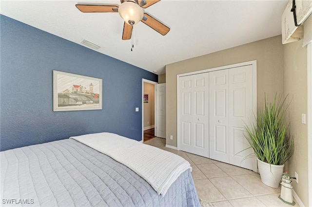5010 La Costa Island Ct, Punta Gorda, FL 33950 - bedroom featuring light tile patterned flooring, a closet, ceiling fan, and baseboards