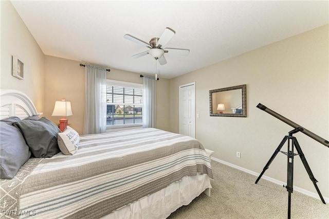 5010 La Costa Island Ct, Punta Gorda, FL 33950 - bedroom featuring baseboards, carpet flooring, a ceiling fan, and a closet