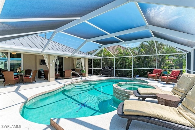 5010 La Costa Island Ct, Punta Gorda, FL 33950 - view of pool featuring outdoor lounge area, a patio area, a pool with connected hot tub, and glass enclosure