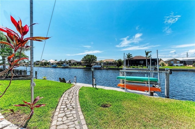 5010 La Costa Island Ct, Punta Gorda, FL 33950 - water view with a boat dock, boat lift, and nearby suburban area