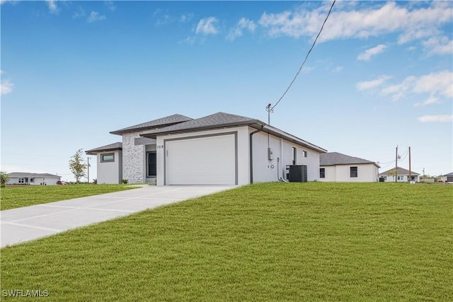 view of front of property with driveway, cooling unit, a front yard, and an attached garage