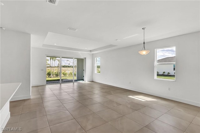44494 Little Blue Heron Way, Punta Gorda, FL 33982 - spare room featuring tile patterned flooring, baseboards, a tray ceiling, and recessed lighting