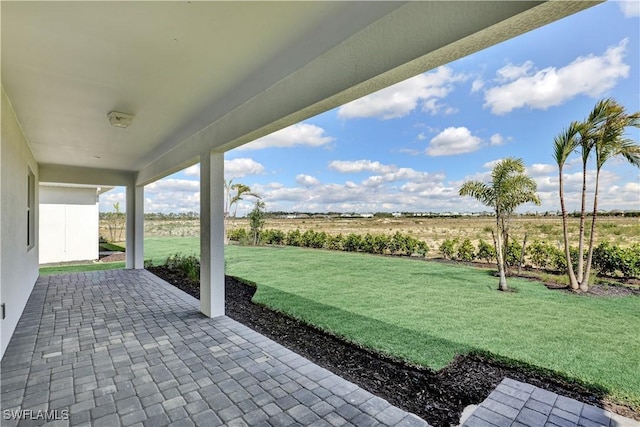 44494 Little Blue Heron Way, Punta Gorda, FL 33982 - view of green lawn featuring a patio area and a view of rural / pastoral area