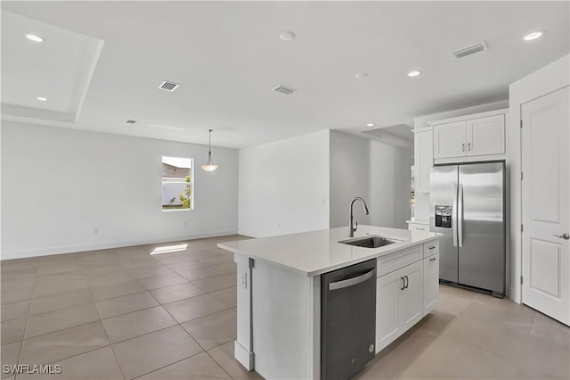 44494 Little Blue Heron Way, Punta Gorda, FL 33982 - kitchen featuring appliances with stainless steel finishes, a sink, a kitchen island with sink, white cabinets, and recessed lighting