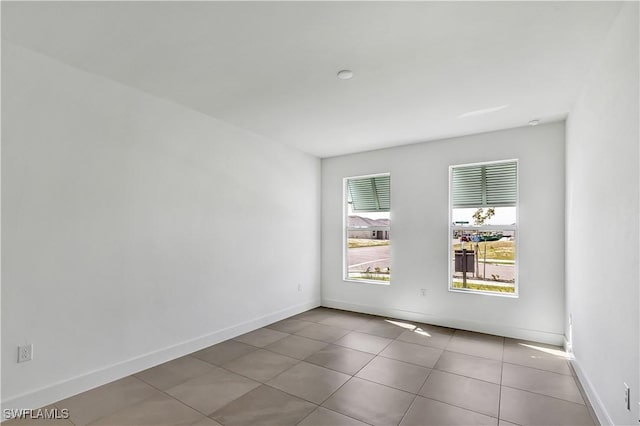 44494 Little Blue Heron Way, Punta Gorda, FL 33982 - unfurnished room with tile patterned floors and baseboards