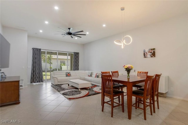 8546 Silk Oak Ln, Naples, FL 34119 - dining area with recessed lighting, ceiling fan, baseboards, a chandelier, and light tile patterned floors