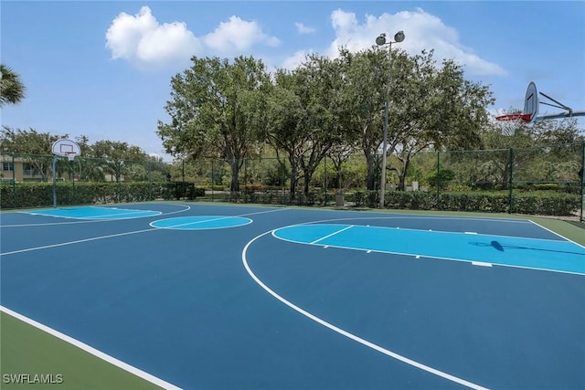 8546 Silk Oak Ln, Naples, FL 34119 - view of basketball court featuring community basketball court and fence