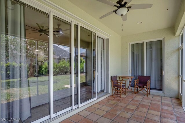 8546 Silk Oak Ln, Naples, FL 34119 - sunroom / solarium featuring a ceiling fan