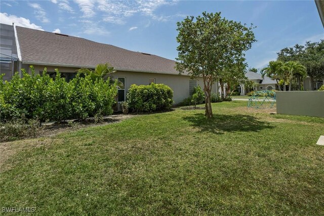 8546 Silk Oak Ln, Naples, FL 34119 - view of green lawn