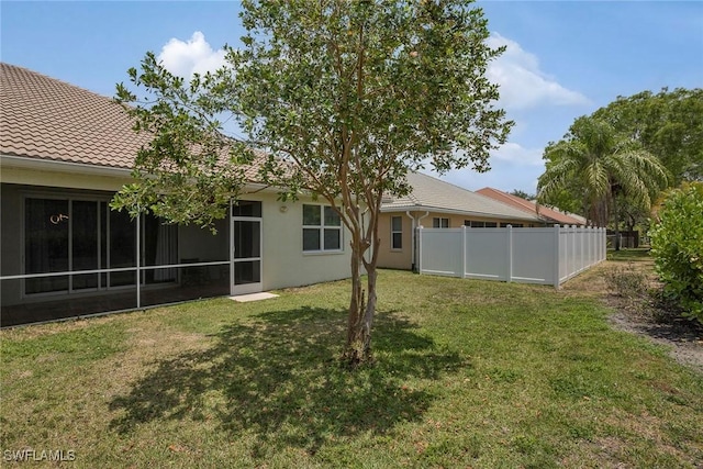 8546 Silk Oak Ln, Naples, FL 34119 - back of property with stucco siding and a tiled roof