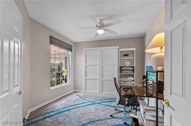office with baseboards and a ceiling fan