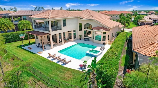 2954 Cinnamon Bay Cir, Naples, FL 34119 - rear view of house with a balcony, a tile roof, a pool with connected hot tub, stucco siding, and a patio area