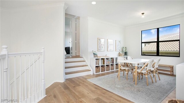 2954 Cinnamon Bay Cir, Naples, FL 34119 - dining room with light wood-type flooring and ornamental molding