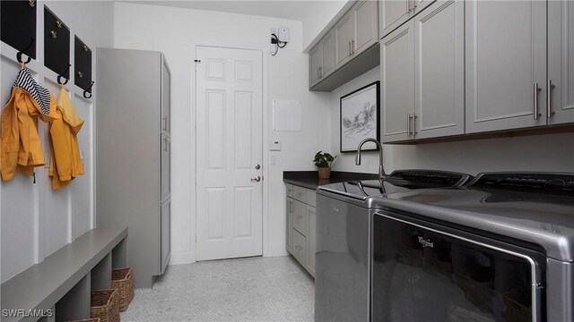 2954 Cinnamon Bay Cir, Naples, FL 34119 - laundry room featuring cabinet space and washing machine and dryer