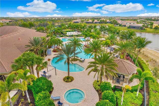 2954 Cinnamon Bay Cir, Naples, FL 34119 - community pool with a community hot tub and a patio