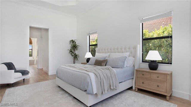 2954 Cinnamon Bay Cir, Naples, FL 34119 - bedroom featuring wood finished floors, ornamental molding, baseboards, and ensuite bathroom