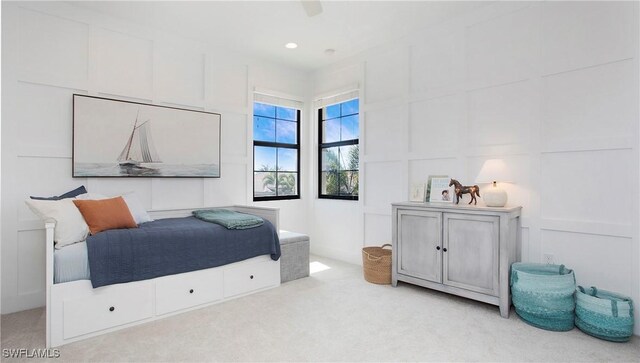 2954 Cinnamon Bay Cir, Naples, FL 34119 - bedroom featuring light colored carpet and a decorative wall