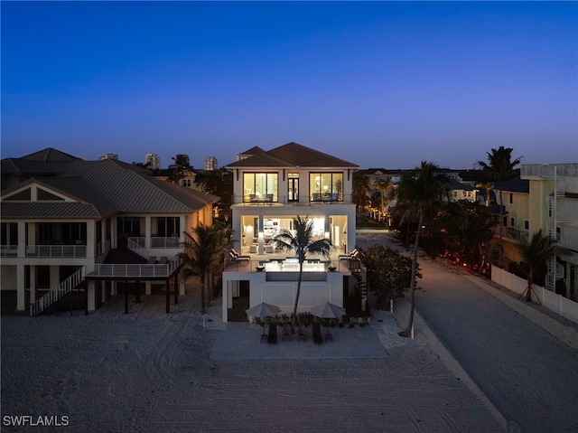 26924 Hickory Blvd, Bonita Springs, FL 34134 - view of front of house featuring a balcony and stucco siding