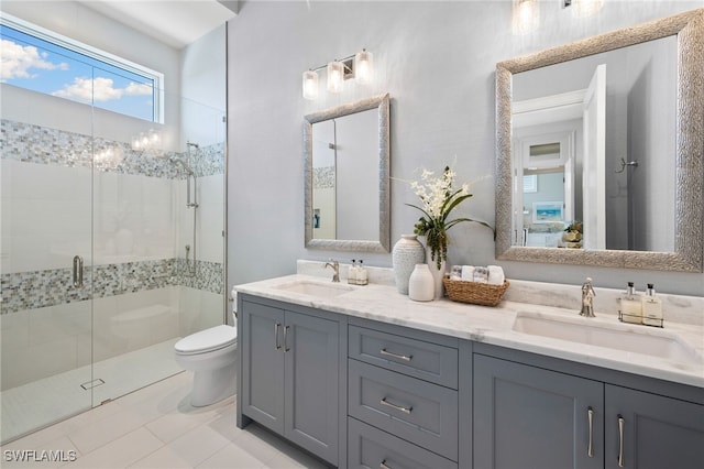 26924 Hickory Blvd, Bonita Springs, FL 34134 - full bathroom featuring toilet, a shower stall, and double vanity
