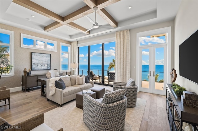26924 Hickory Blvd, Bonita Springs, FL 34134 - living room with coffered ceiling, light wood finished floors, a ceiling fan, french doors, and beam ceiling