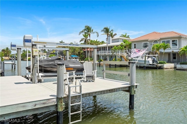 388 Pine Ave, Naples, FL 34108 - dock area featuring boat lift and a water view