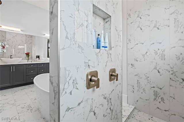 388 Pine Ave, Naples, FL 34108 - bathroom with vanity, a marble finish shower, marble tiled floors, and a soaking tub