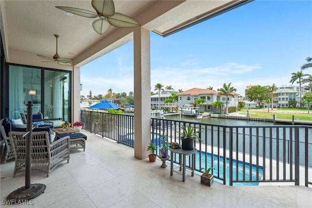 388 Pine Ave, Naples, FL 34108 - balcony featuring a water view, ceiling fan, a residential view, and a patio area