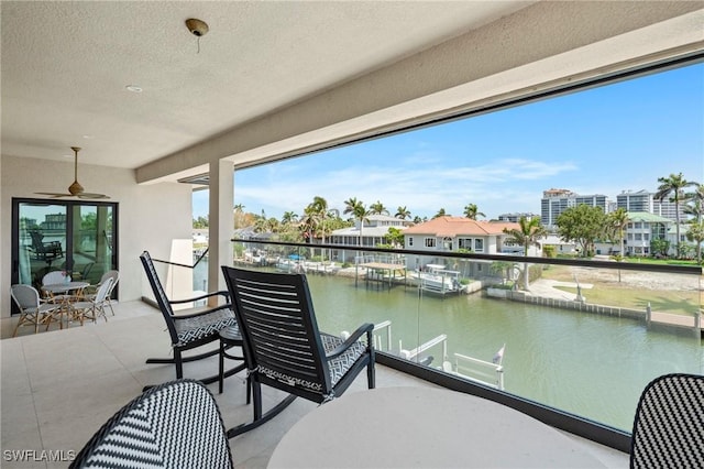 388 Pine Ave, Naples, FL 34108 - balcony with a water view and ceiling fan