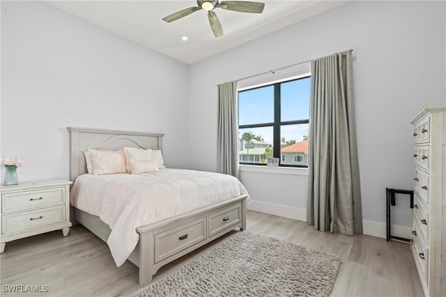 388 Pine Ave, Naples, FL 34108 - bedroom with light wood-style flooring, baseboards, and a ceiling fan