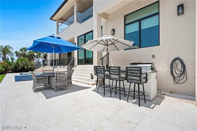388 Pine Ave, Naples, FL 34108 - view of patio / terrace featuring stairs and outdoor dining space