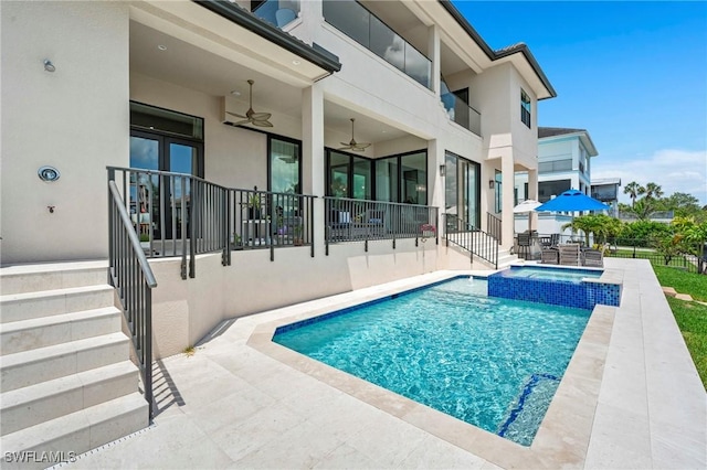 388 Pine Ave, Naples, FL 34108 - view of swimming pool with ceiling fan, a patio, and a pool with connected hot tub